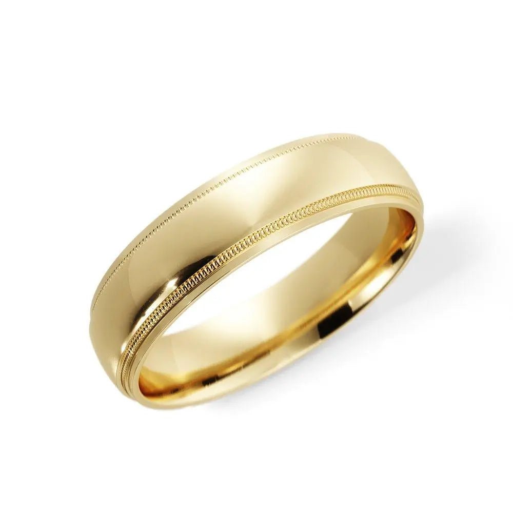 Side view of a 6mm 14K gold wedding band with milgrain edges and classic dome shape, handcrafted in NYC.