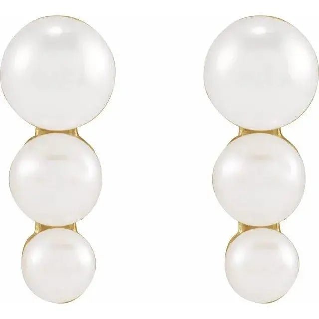 Side view of Iris Pearl Earrings showing gold setting and pearl luster