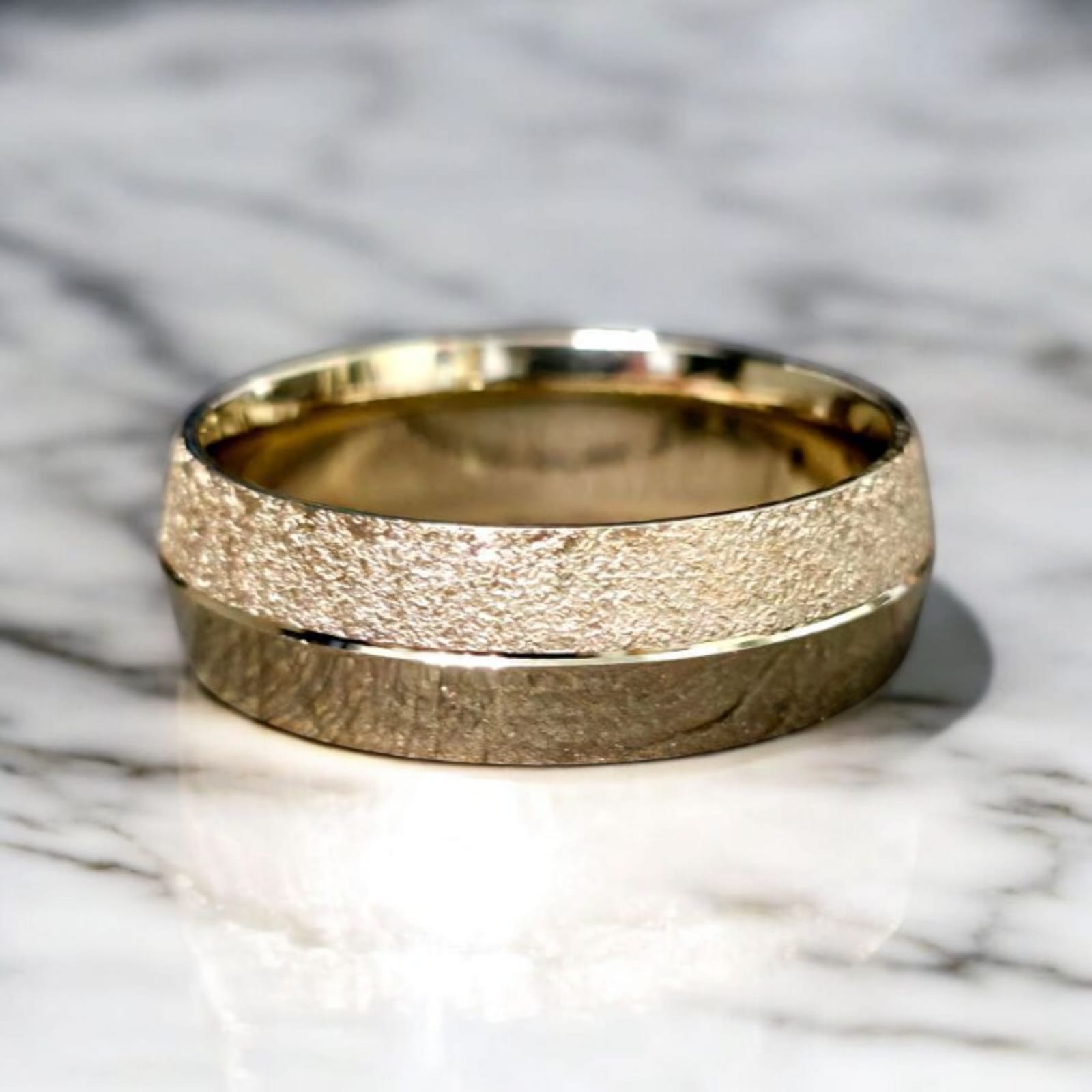 7mm knife edge wedding ring in 14K yellow gold with stone and polish finish