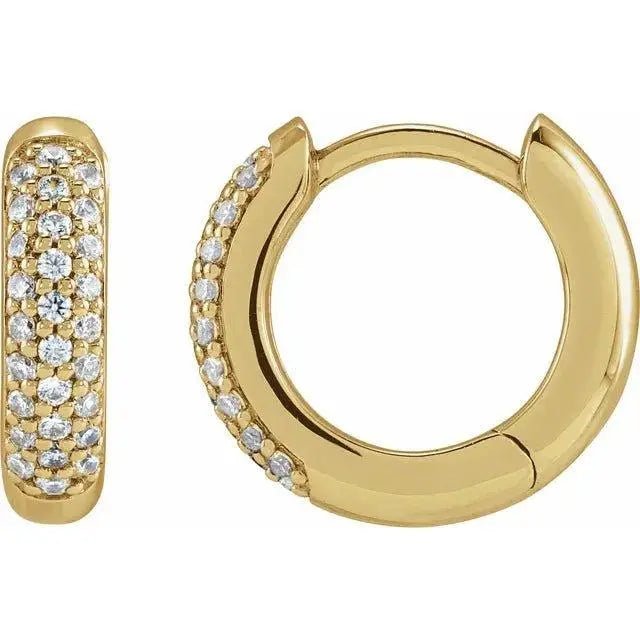 Close-up photo of 14K gold lab grown diamond hoop earrings with eco-friendly diamonds, handcrafted in NYC.