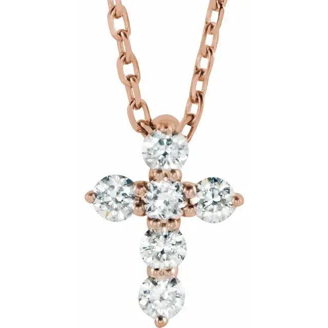 Rose gold mini diamond cross necklace with six sparkling natural diamonds on an adjustable 16-18 inch chain. A dainty and elegant religious pendant.