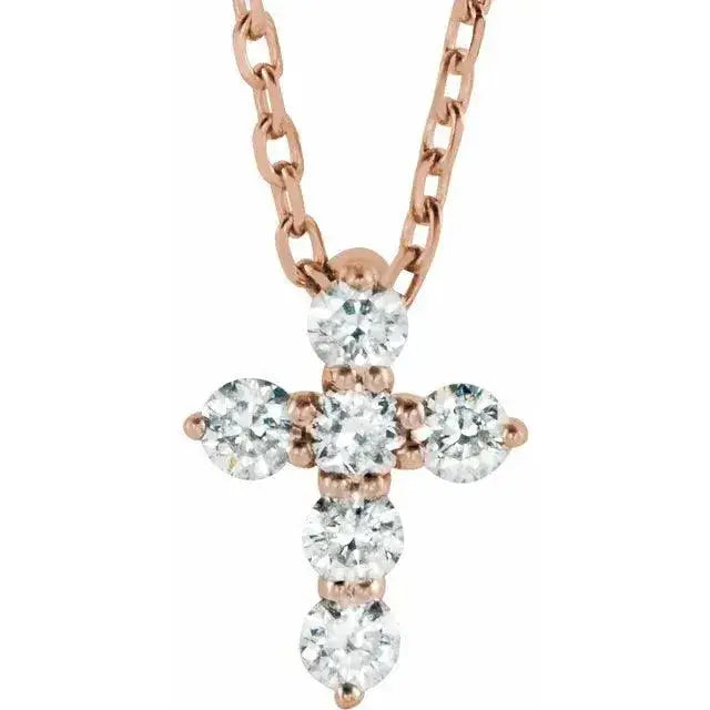 Rose gold mini diamond cross necklace with six sparkling natural diamonds on an adjustable 16-18 inch chain. A dainty and elegant religious pendant.