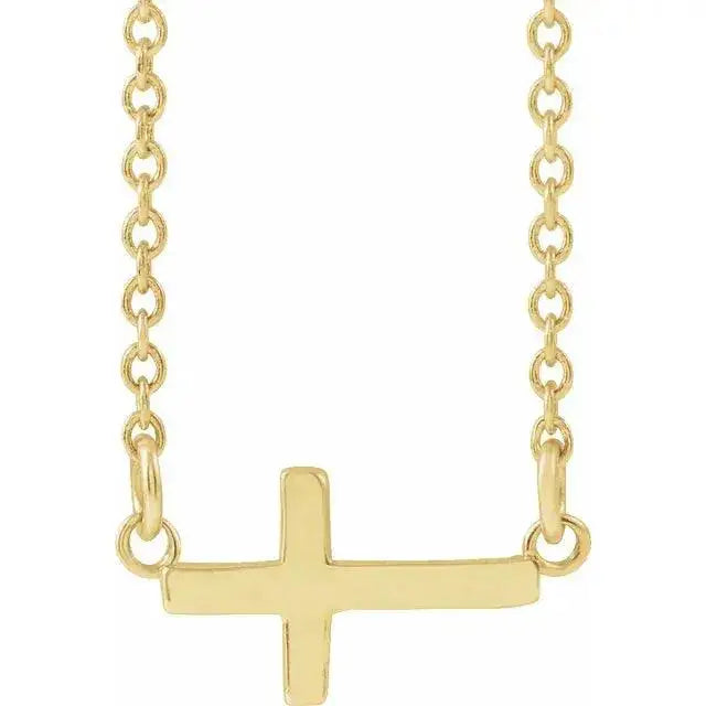 Mini Sideways Cross Necklace in 14K gold with a delicate chain. A minimalist faith-inspired jewelry piece, perfect for everyday wear or gifting.