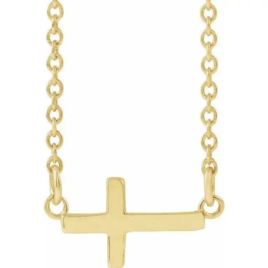 Mini Sideways Cross Necklace in 14K gold with a delicate chain. A minimalist faith-inspired jewelry piece, perfect for everyday wear or gifting.