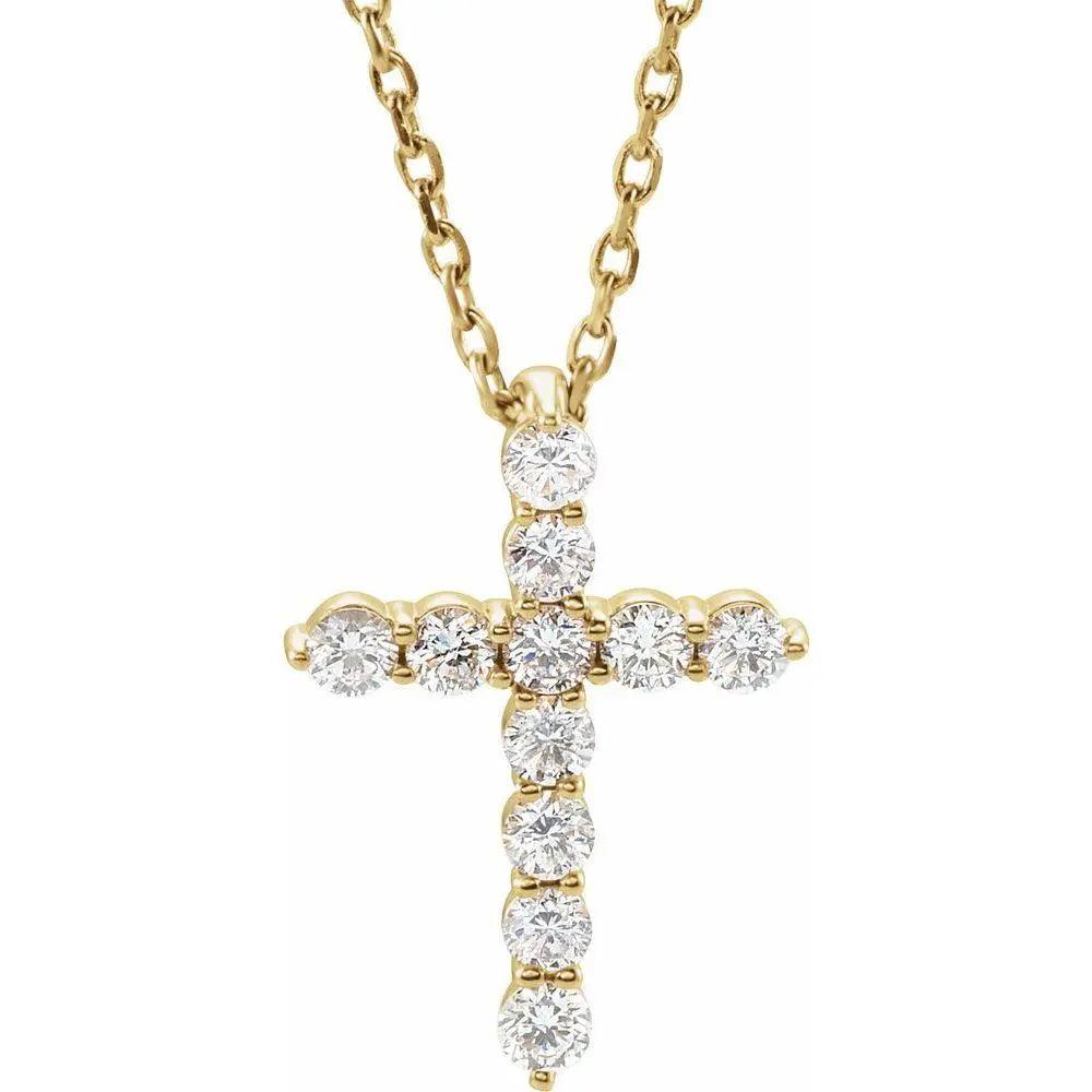 Close-up photo of 14K gold diamond cross necklace with 1/4 carat natural diamonds, handcrafted in NYC.