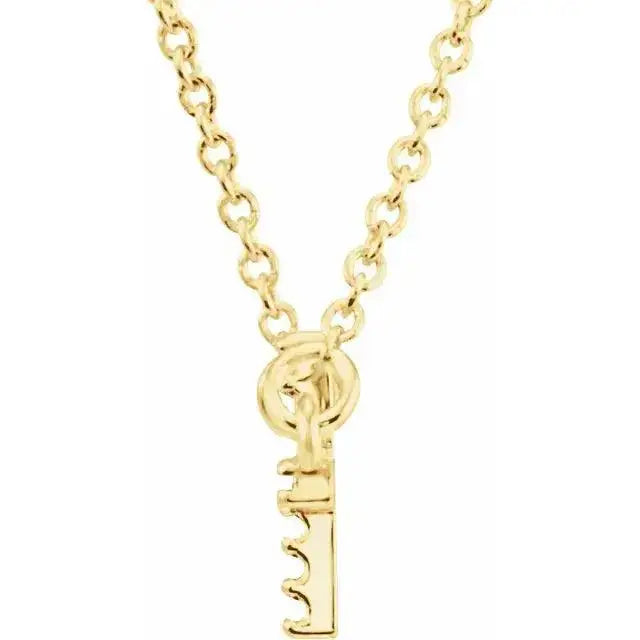 Close-up of a 14K gold necklace with a key-shaped pendant, showcasing a polished finish and sturdy chain. A stylish and meaningful jewelry piece.