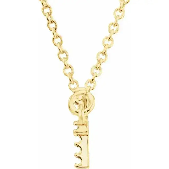 Close-up of a 14K gold necklace with a key-shaped pendant, showcasing a polished finish and sturdy chain. A stylish and meaningful jewelry piece.