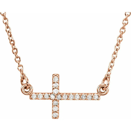 Natural Diamonds Sideways Cross Necklace in 14K rose gold with a delicate, faith-inspired design. Features a diamond-studded cross pendant on an adjustable chain.