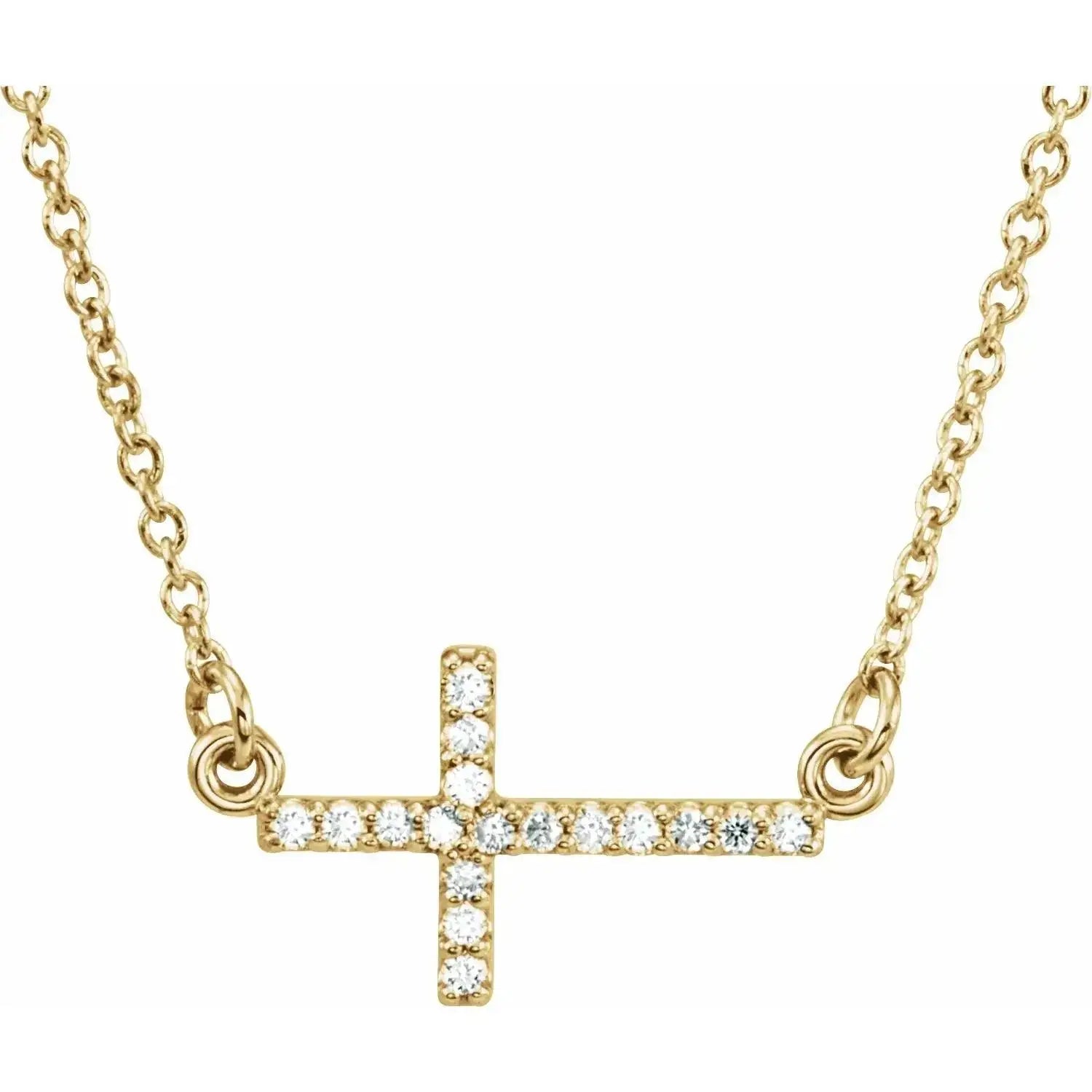Close-up photo of 14K gold sideways cross necklace, handcrafted in NYC.