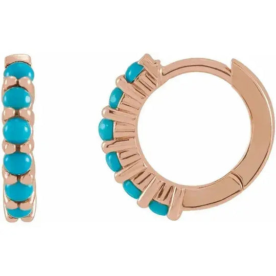 Natural turquoise huggie hoop earrings in 14K rose gold with striking turquoise stones. A 12.2mm hoop design blending bold color and elegance.