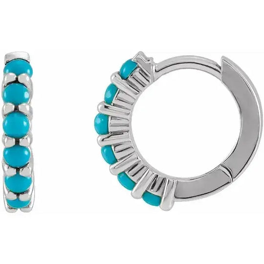 Natural turquoise huggie hoop earrings in 14K white gold with vibrant turquoise stones. Elegant 12.2mm design for a modern, timeless appeal.