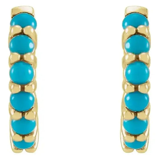 Front view of natural turquoise huggie hoop earrings in 14K gold. Features vibrant turquoise stones in a 12.2mm hoop for a stylish look.