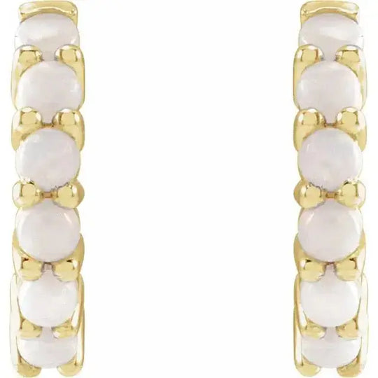 Elegant gold hoop earrings with natural white opals