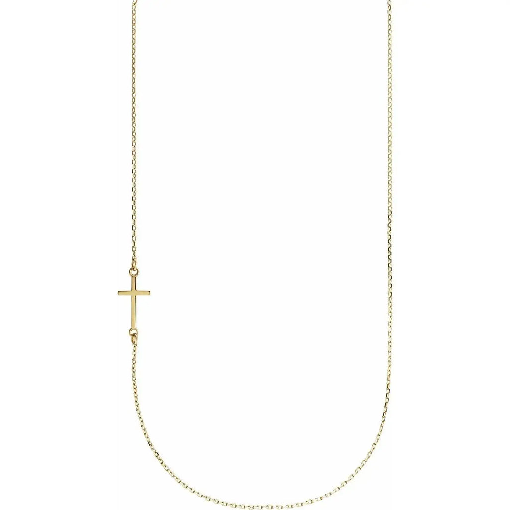 Close-up photo of an off-center sideways cross necklace handcrafted in 14K gold in NYC.