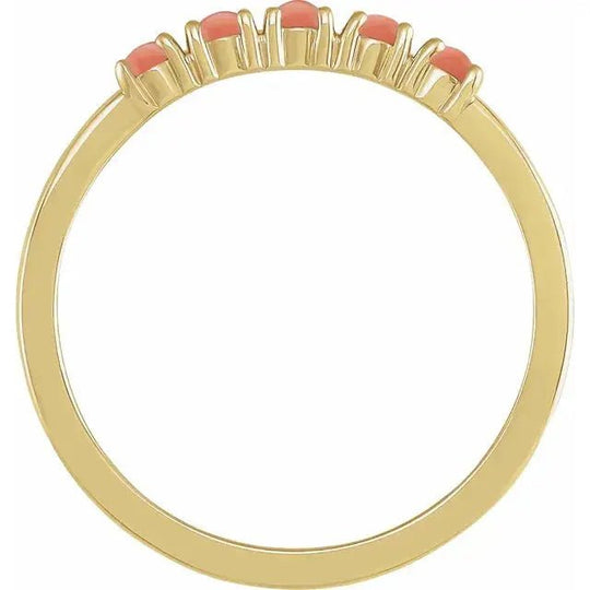 Elegant gold ring with natural pink coral centerpiece