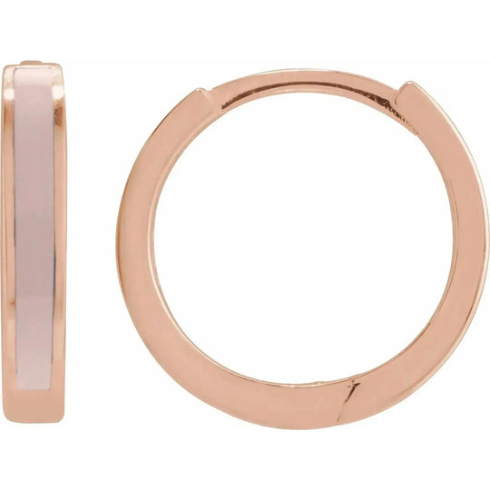 Rose gold pink enamel hoop earrings with a sleek, modern design. Crafted in solid gold, these hinged hoops add a touch of sophistication to any look.