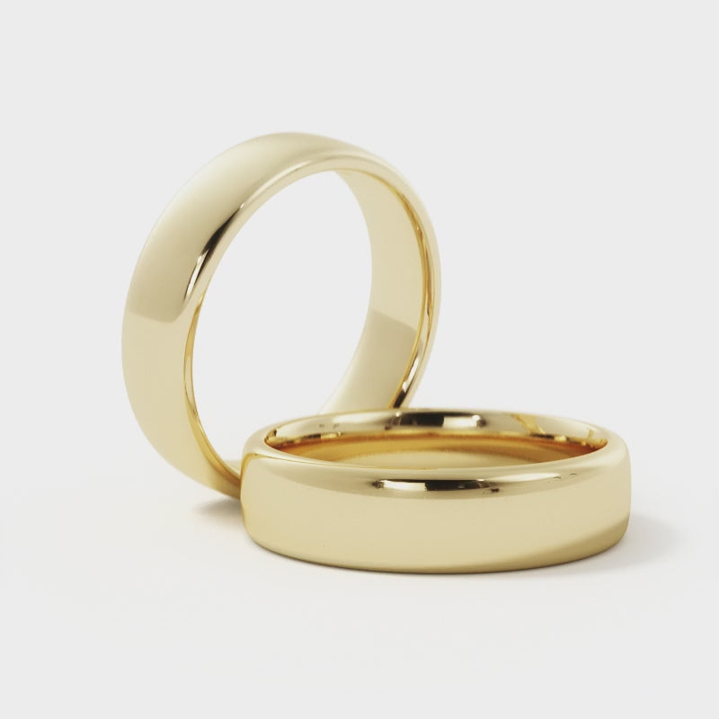 360-degree view of 14k yellow gold 5mm rounded edge wedding band with polished finish, showcasing timeless design.