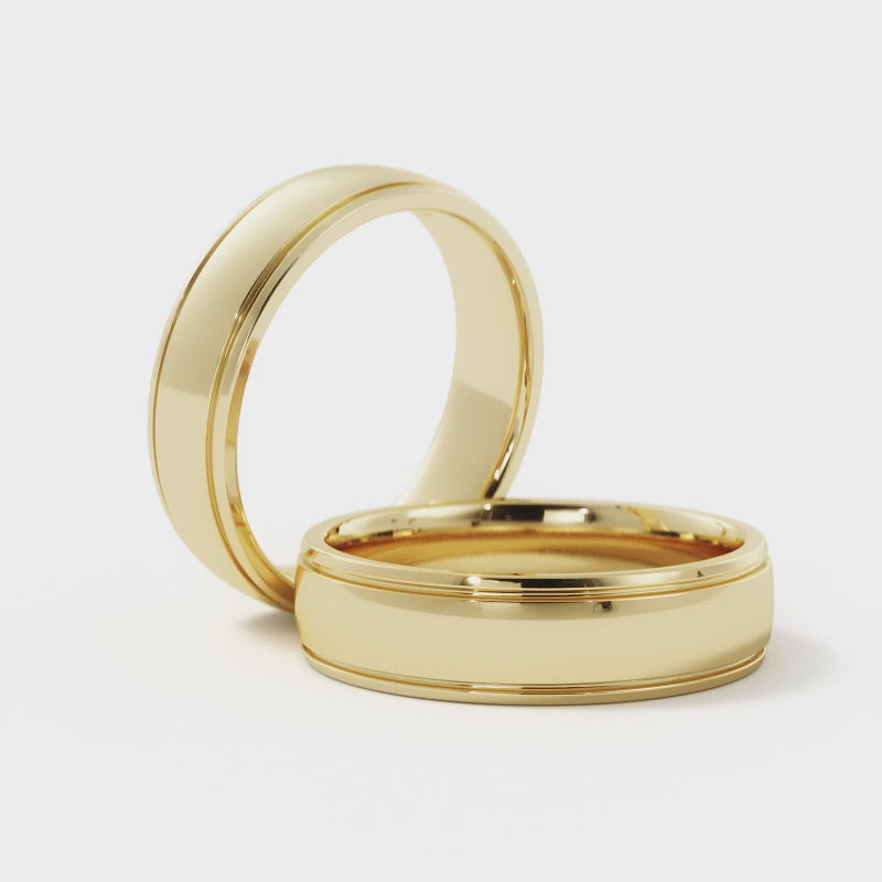Video showcasing the 14K gold 5mm groove edge wedding band, highlighting its polished finish, groove detail, and comfort fit design from multiple angles.
