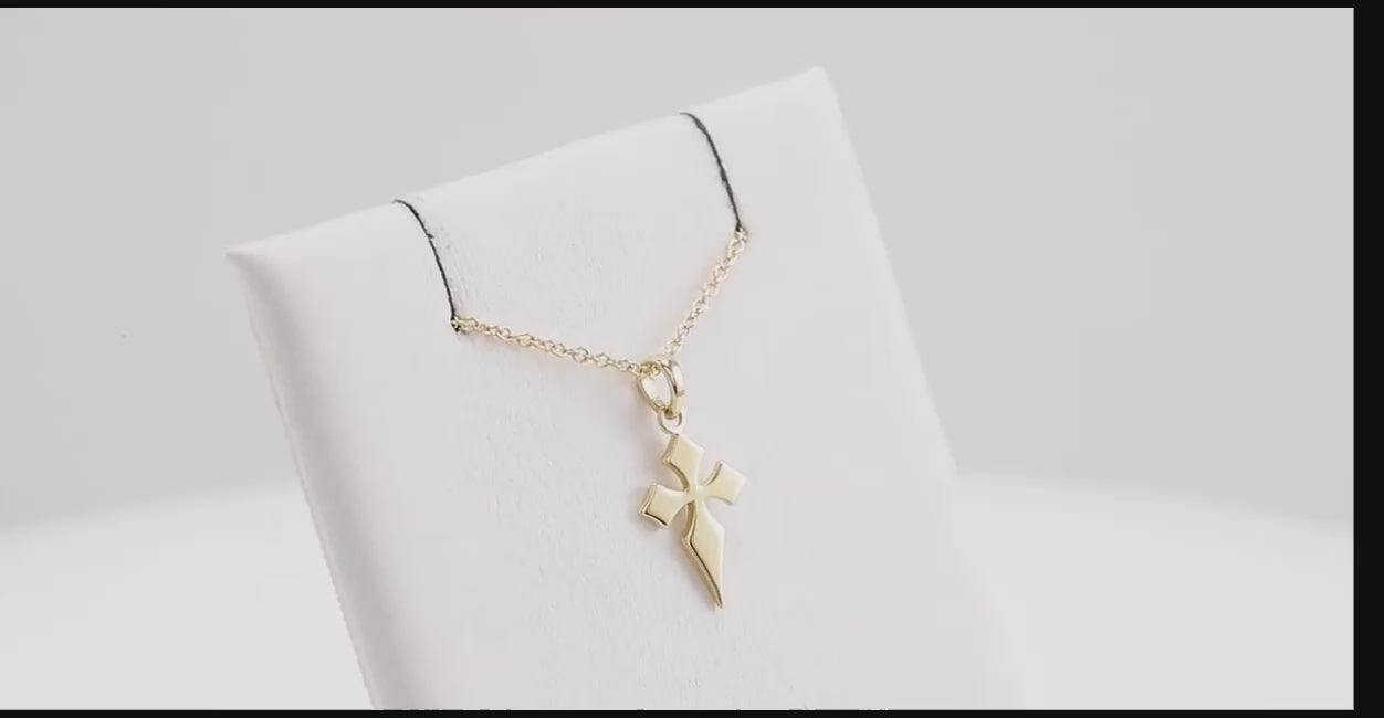 Modern Cross Necklace in 14K gold displayed on a white jewelry stand, highlighting its sleek and polished design. A perfect faith-inspired gift or accessory.