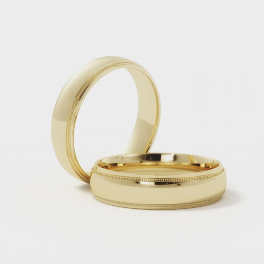 360-degree view of 10K gold wedding band with milgrain edge and polished finish.