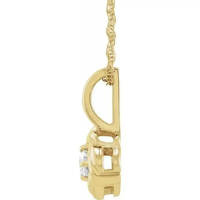 Side view of the handcrafted solid gold Rose Pendant, showcasing its intricate design and diamond setting. A luxurious and elegant jewelry piece.