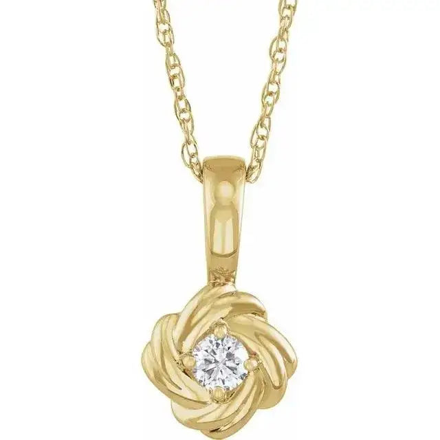 Close-up photo of 14K gold rose pendant necklace with detailed floral design, handcrafted in NYC.