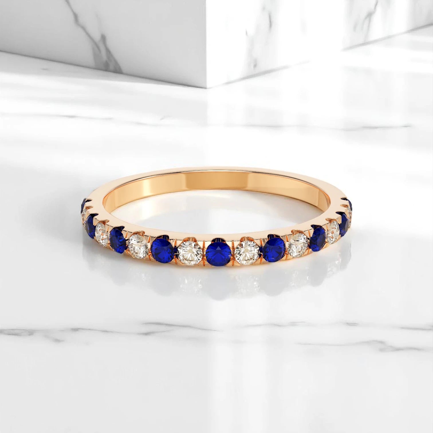 Rose gold half eternity ring with alternating lab sapphires and diamonds