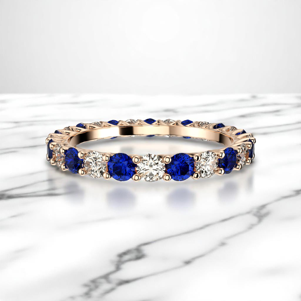 14K rose gold eternity band with blue sapphire and diamond stones