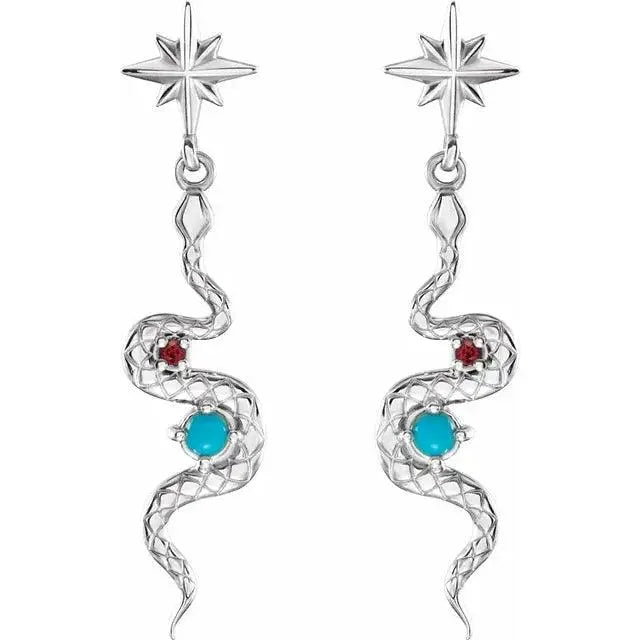 Close-up of silver snake earrings featuring natural turquoise and ruby