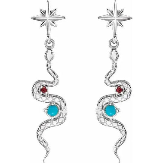 Close-up of silver snake earrings featuring natural turquoise and ruby