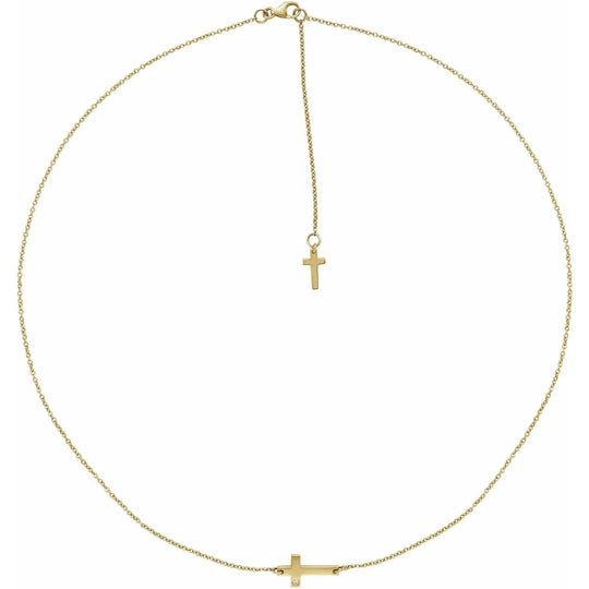 Small natural diamonds sideways cross necklace in 14K gold