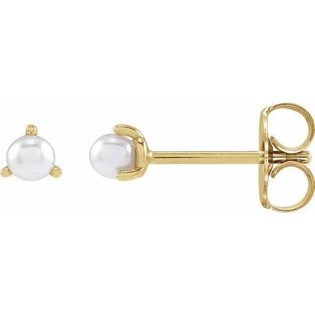 Close-up photo of single freshwater pearl stud earring in 14K gold or platinum, handcrafted in NYC.