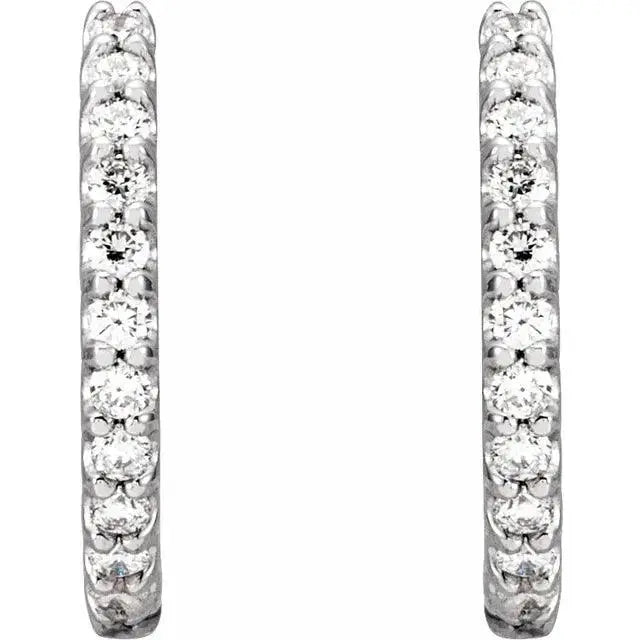 Close-up of 14mm diamond-studded silver hoop earrings
