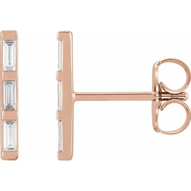 Three Baguette Diamond Bar Earrings in 14K rose gold with natural diamonds. Elegant and modern stud earrings with 0.45 carats of baguette-cut diamonds.