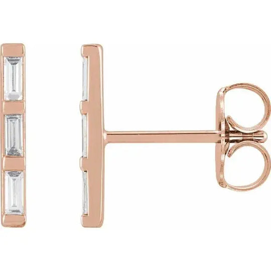 Three Baguette Diamond Bar Earrings in 14K rose gold with natural diamonds. Elegant and modern stud earrings with 0.45 carats of baguette-cut diamonds.