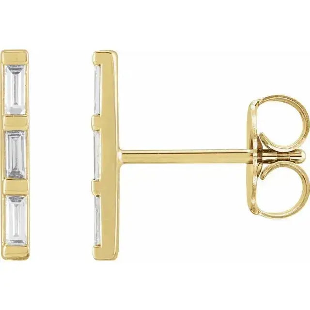 Close-up of handcrafted 6 baguette diamond bar earrings in solid yellow gold, 7.5mm long, modern minimalist design