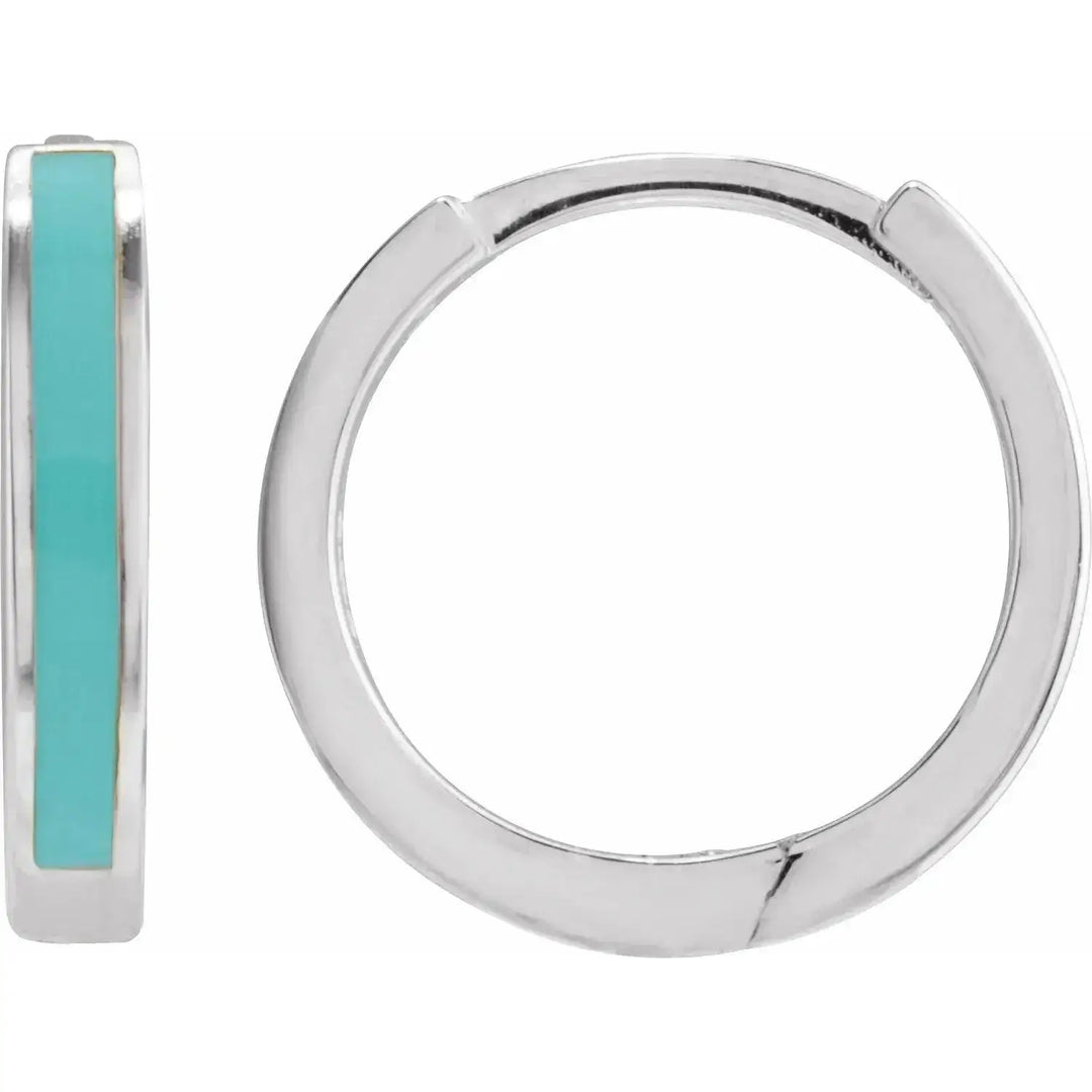 Sterling silver turquoise enamel hoop earrings with a sleek, modern design. Featuring a vibrant turquoise enamel stripe and a secure hinged clasp.