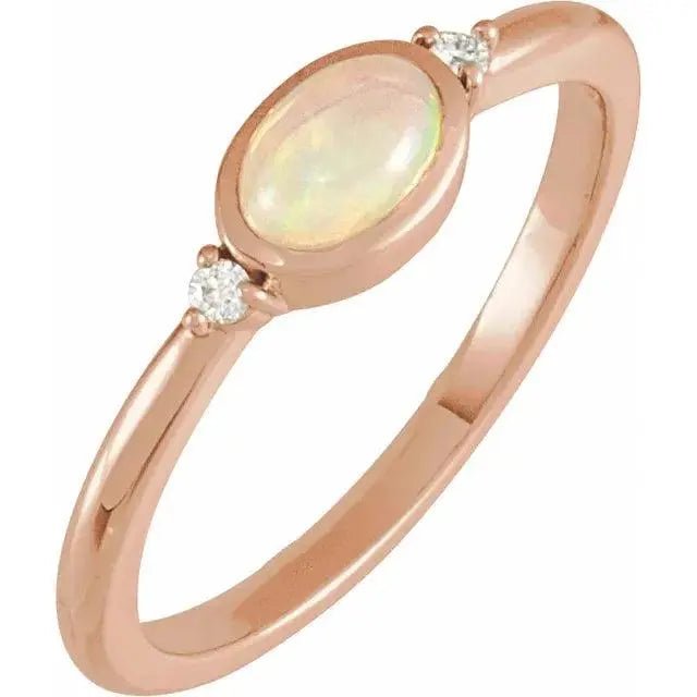 Rose gold White Ethiopian Opal Ring featuring a bezel-set opal and diamond accents. A handcrafted luxury gemstone ring with a warm, elegant finish.