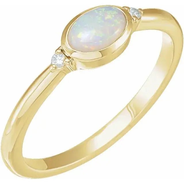 Elegant White Ethiopian Opal Ring in solid gold with a bezel-set opal and diamond accents. A timeless handcrafted gemstone ring for any occasion.