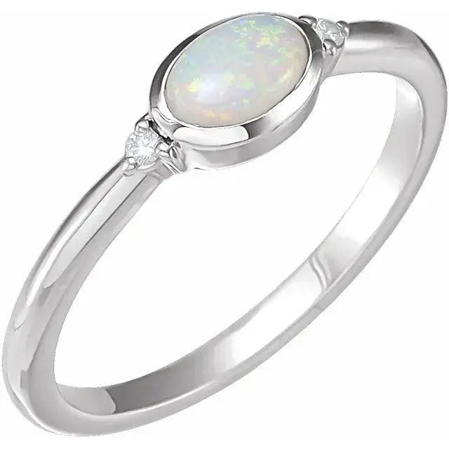 White Ethiopian Opal Ring in solid white gold with a luminous opal centerpiece and diamond accents. A luxurious handcrafted gemstone jewelry piece.