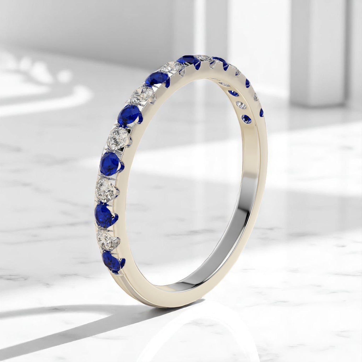 Delicate alternating gemstone band in yellow gold with sapphire and diamond accents
