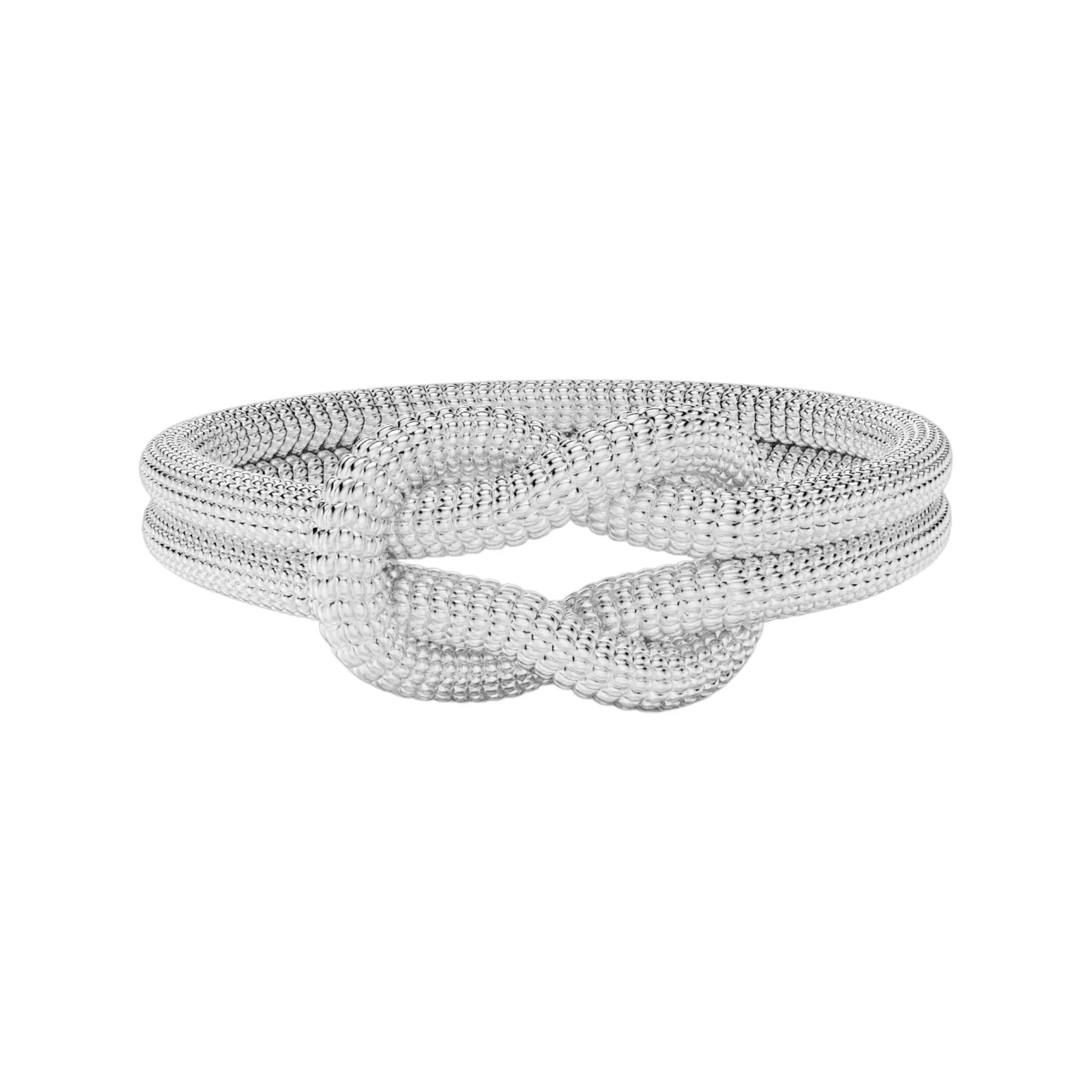 Unity rope ring resting on white fabric, symbolic gold jewelry