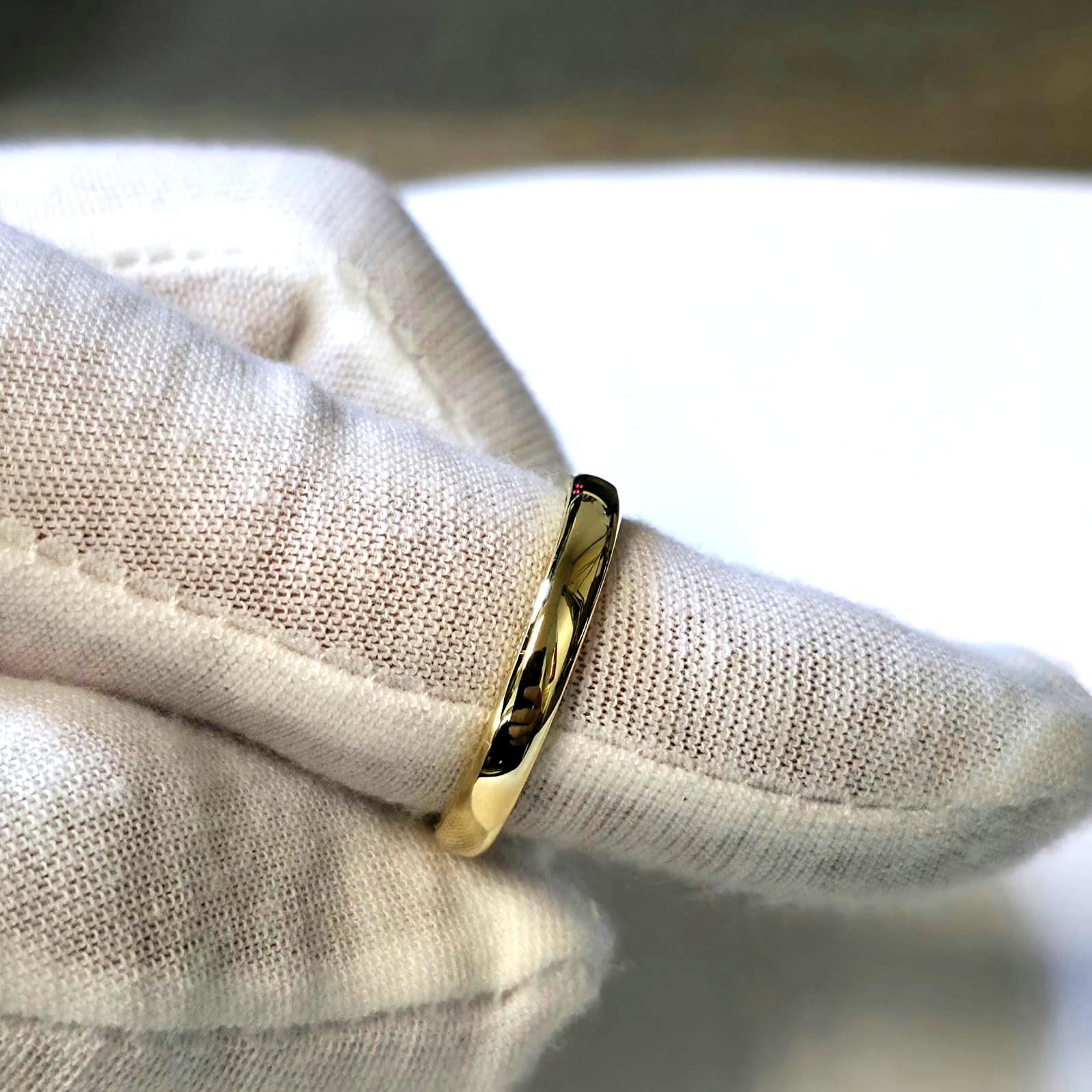 handmade gold wire ring with milgrain edges on fingers – front view
