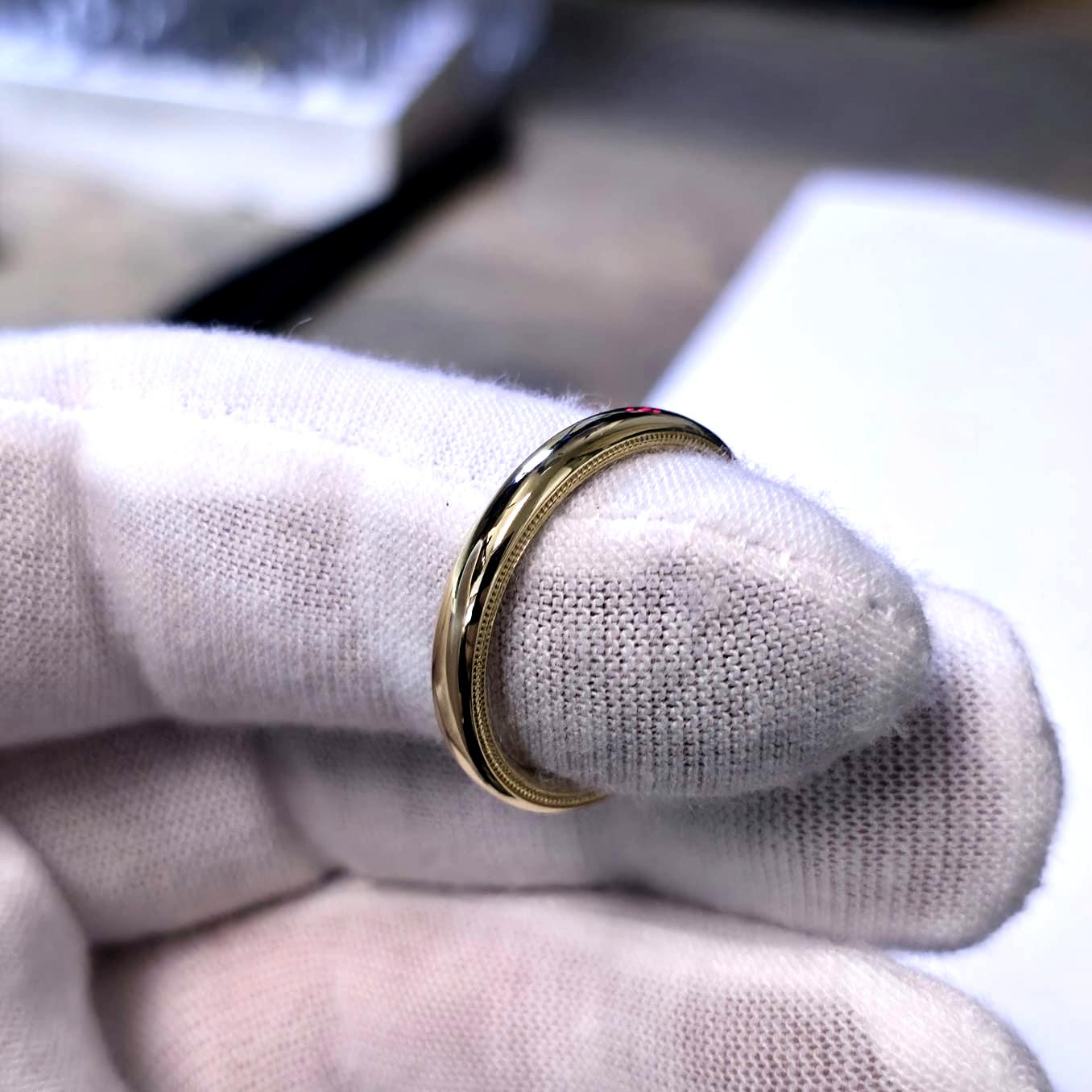 stacked wire rings with milgrain details on hand – minimalist gold jewelry
