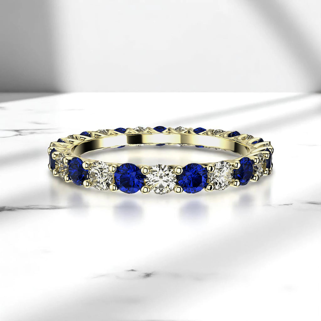 Alternating sapphire and diamond ring in yellow gold prong setting