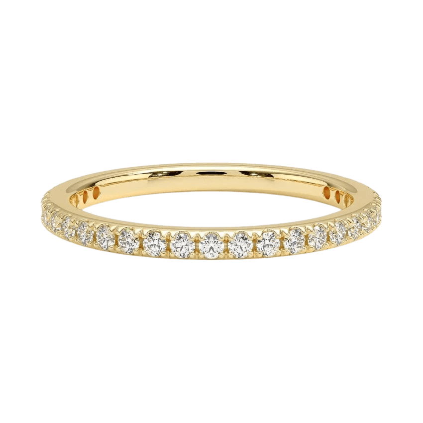 Close-up photo of the Dion 14K gold diamond wedding band with flush-set diamonds, handcrafted in NYC.